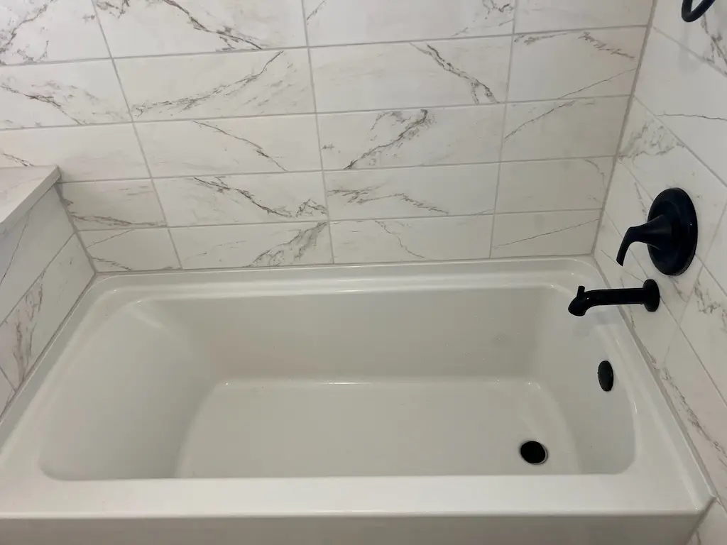 Modern tiled bathroom with bathtub progress