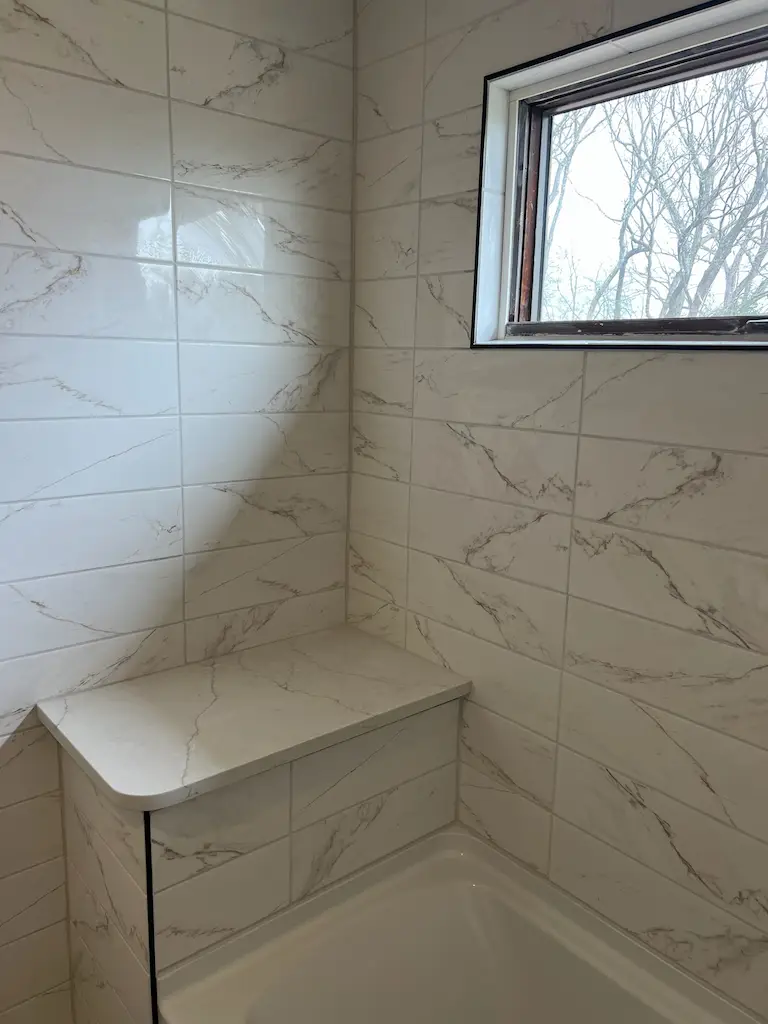 Modern tiled bathroom with bathtub progress