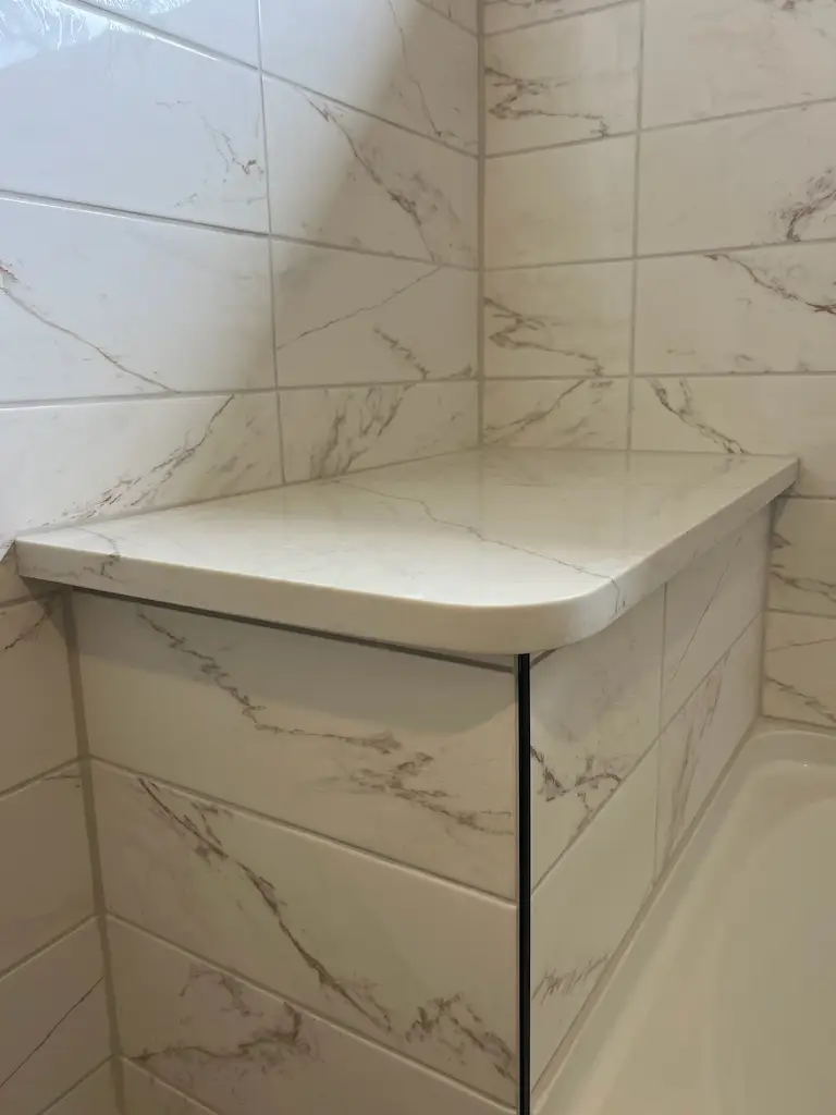Modern tiled bathroom with bathtub progress