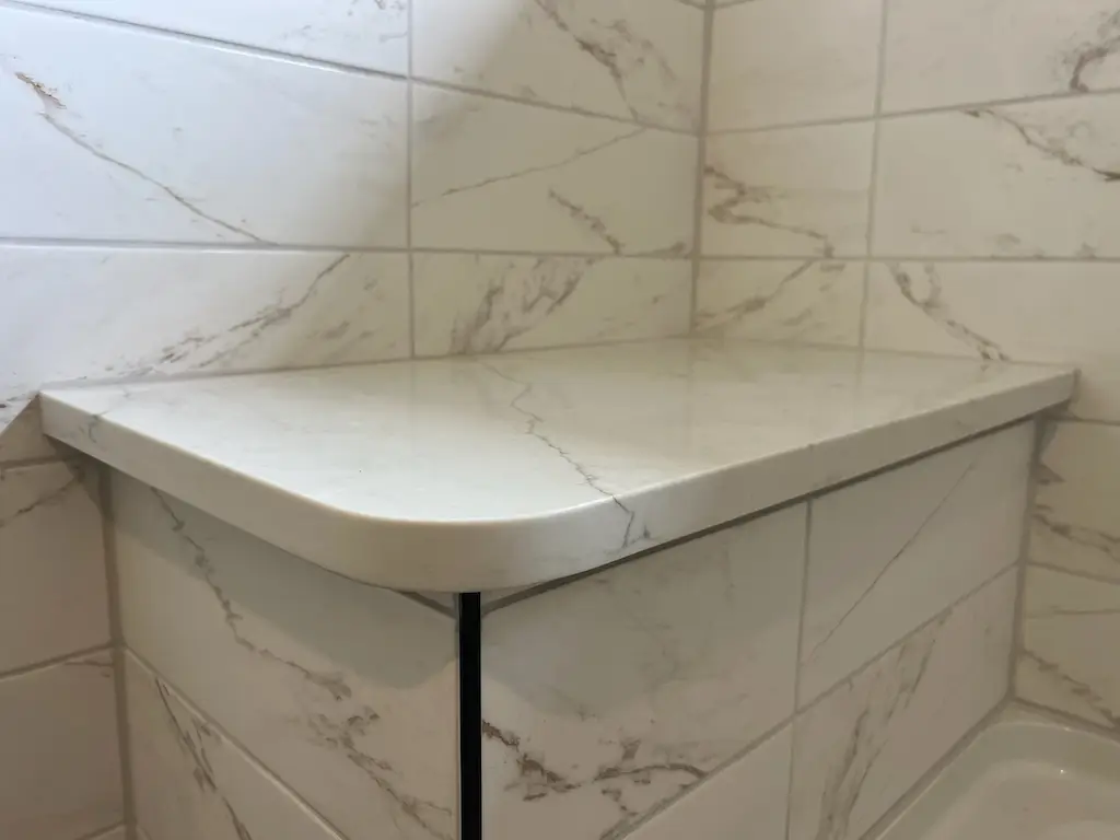 Modern tiled bathroom with bathtub progress