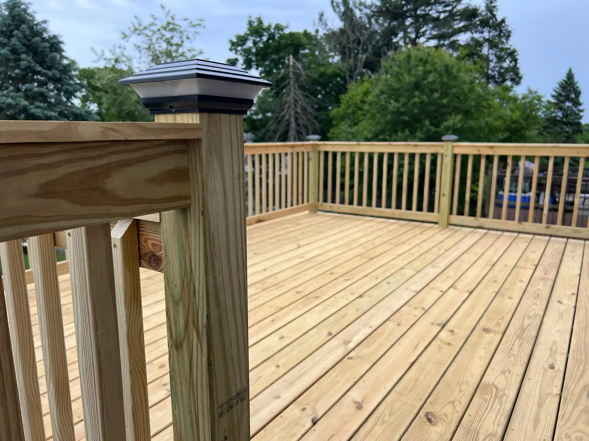 Wooden deck addition on a backyard home progress