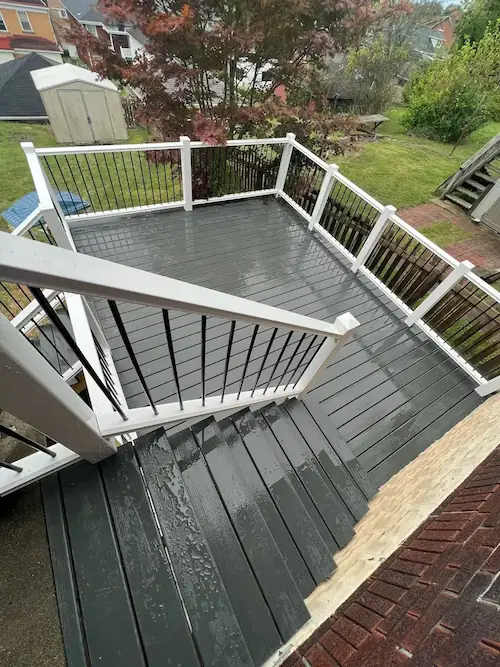 Wooden deck addition on a backyard home progress