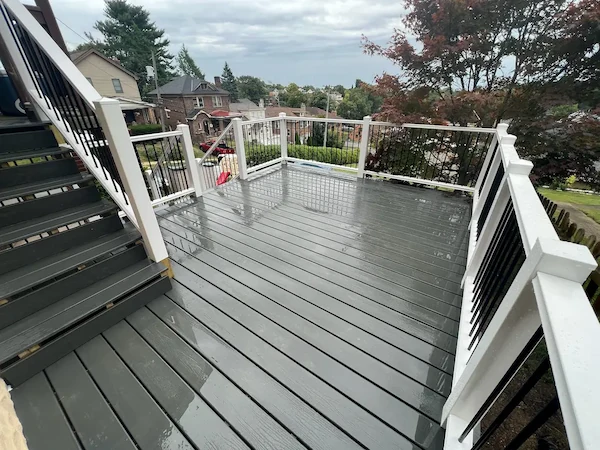 Wooden deck addition on a backyard home progress