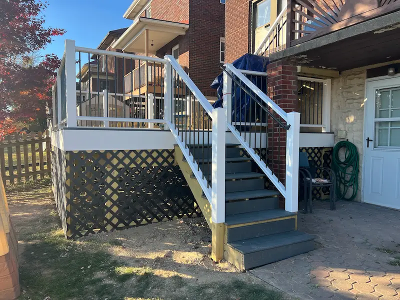 Wooden deck addition on a backyard home progress